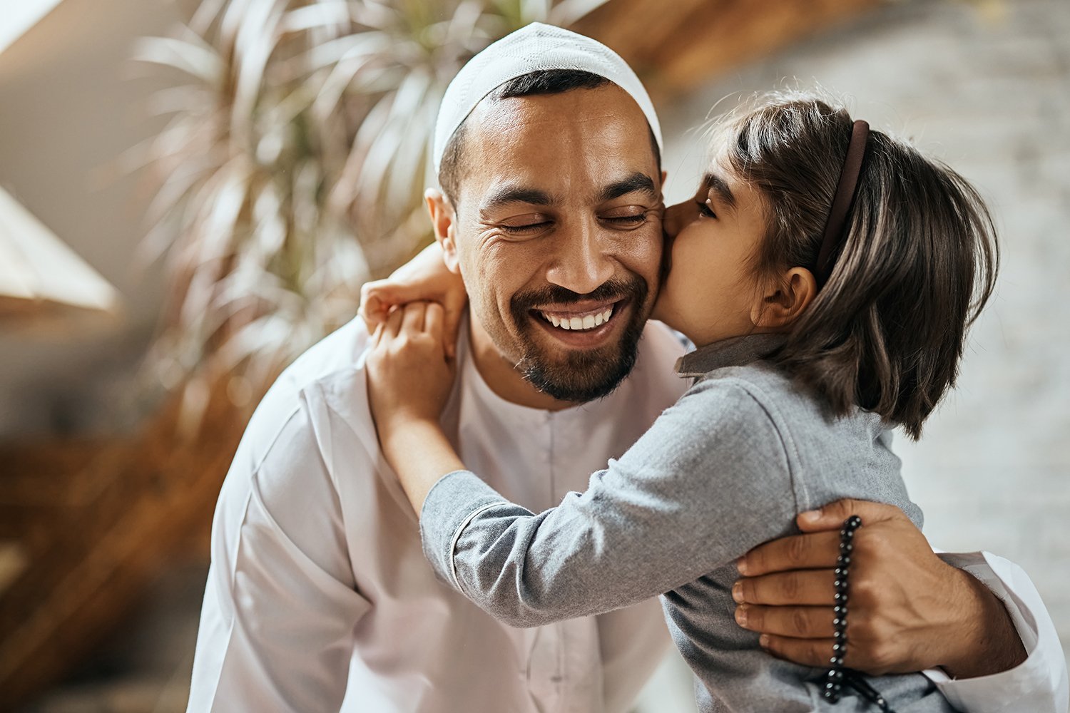 Man hugging his daughter